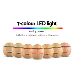 Row of Devanti wood-textured aroma diffusers each glowing in different LED colours; gradient bar and text highlight 7-colour mood lighting