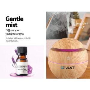 Devanti wood-textured spherical diffuser emitting ultra-fine mist; lavender oil bottle and flowers shown beside