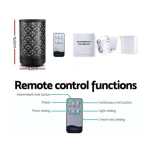 Aroma diffuser with floral black casing, remote control, user manual, power adapter, and measuring cup; diagram shows remote functions