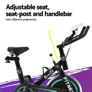 close-up of Everfit FITNESS exercise bike showing adjustable seat, seat-post, and handlebar with yellow arrows, digital monitor, and turquoise-accented flywheel for personalized indoor workouts
