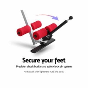 Inversion table close-up of fitness equipment foot lock system with red foam rollers, black lever arm, and base plate, showing arrow for movement direction and labeled precision chuck buckle with safety lock pin