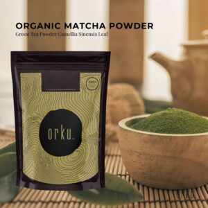 Orku Organic Matcha Powder package with green topographic design and black circle branding, labeled 100% purity, shown with bowl of vibrant green powder and traditional teapot in background to suggest tea preparation