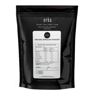 Orku black pouch labeled Organic Spirulina Powder with nutrition panel showing 70g protein and 1600kJ energy per 100g, branded with Strength, Power, Vitality, Energy, and packed in Australia from Indian origin