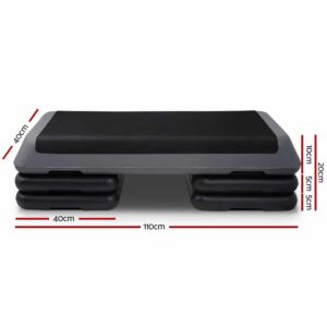 black and gray aerobic step platform with textured surface and stackable risers, shown with labeled measurements: 110cm length, 40cm width, and height options of 10cm, 15cm, and 20cm