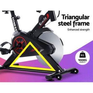 close-up of Everfit spin bike highlighting yellow triangular steel frame design with black and red accents, labeled for enhanced strength and 100kg user capacity