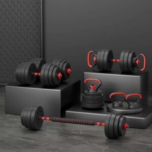 Adjustable dumbbell and barbell set with black plates and red accents displayed in a modern gym setting with dark wall background and platform