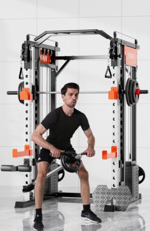 man in black athletic wear performing seated row exercise using cable attachment on smartfit m1 max multifunctional gym machine with orange accents