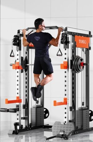 man in athletic wear performing pull-up on smartfit m1 max multifunctional gym machine with orange accents and weight plates