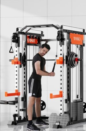 man in black athletic wear performing triceps pushdown using straight bar on smartfit m1 max cable machine with orange accents and weight plates