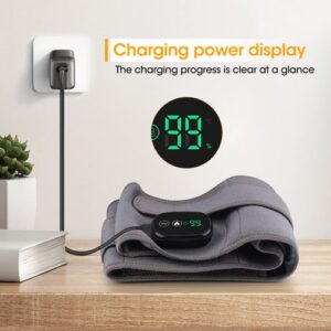 Heated therapy pad on wooden surface showing 99% charge; plugged into wall socket with digital display