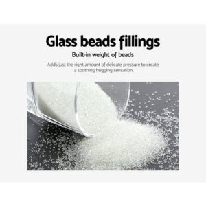 Clear glass beads spilling from container onto flat surface; text highlights soothing pressure benefits