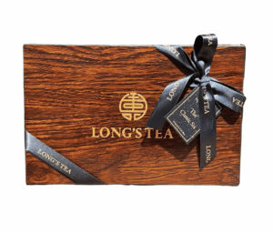 LONG'S TEA Classic Six gift box with dark wood grain, gold emblem, black ribbon, and tag for curated tea selection