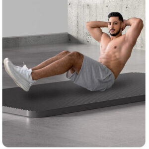 Man performing core exercises on extra thick shock-absorbing exercise mat designed for fitness training, stretching and floor workouts