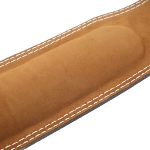Close-up of soft suede lining and foam padded interior on a black weightlifting belt for comfortable lower back support during gym and strength training workouts.