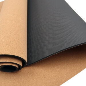 Close up of Powertrain cork yoga mat showing natural cork top layer and textured non-slip base for yoga, pilates and mobility exercises