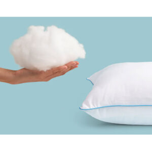 Hand holding premium fibre fill beside the Mediflow Water Pillow highlighting soft comfort and supportive construction
