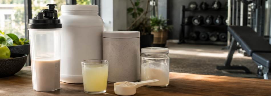 Protein powder, electrolyte drink and recovery nutrition supplements in a modern Australian home gym after exercise
