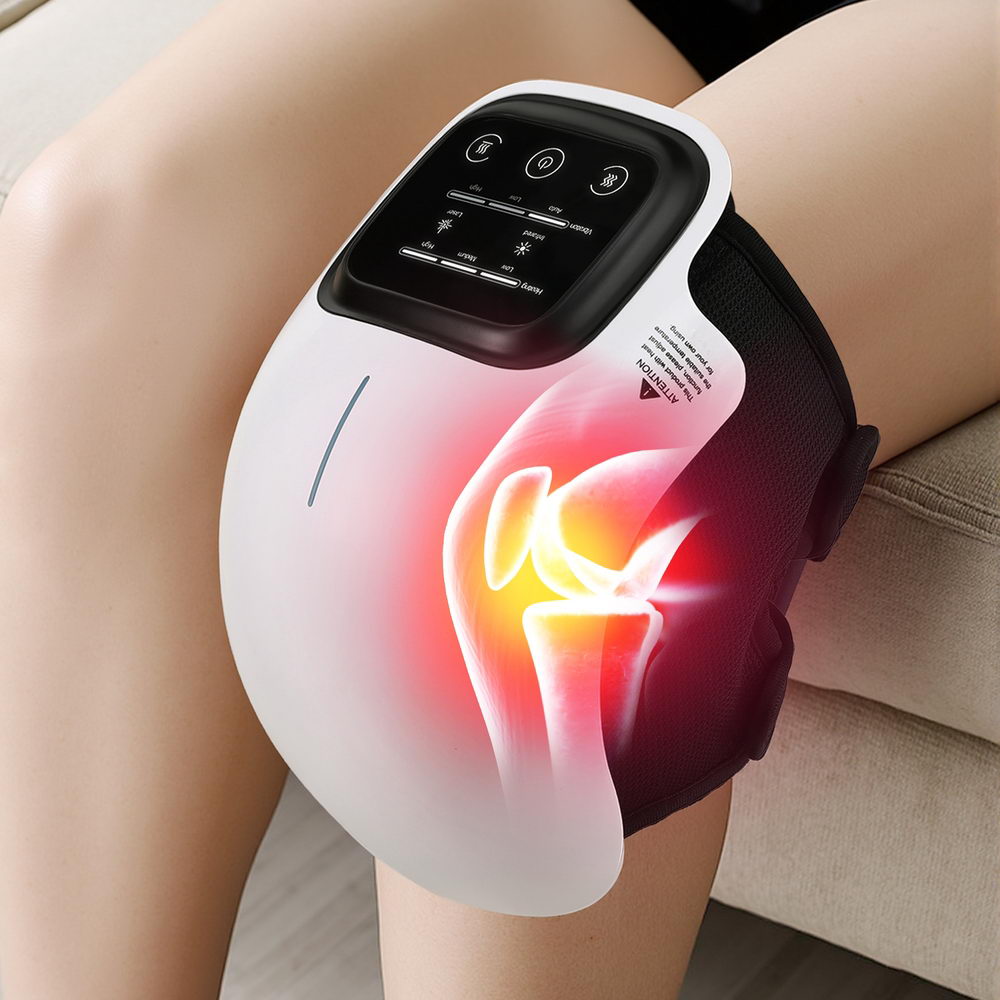 Black and white Livemor knee massager wrap with illuminated display worn on a bent leg.