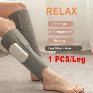 Grey rechargeable calf massager wrap with white controller worn around the lower leg