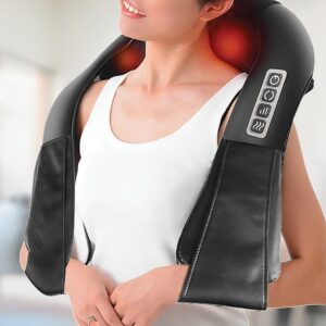 Black heated neck and shoulder massager worn over a white top, showing red heat lights and side controls.