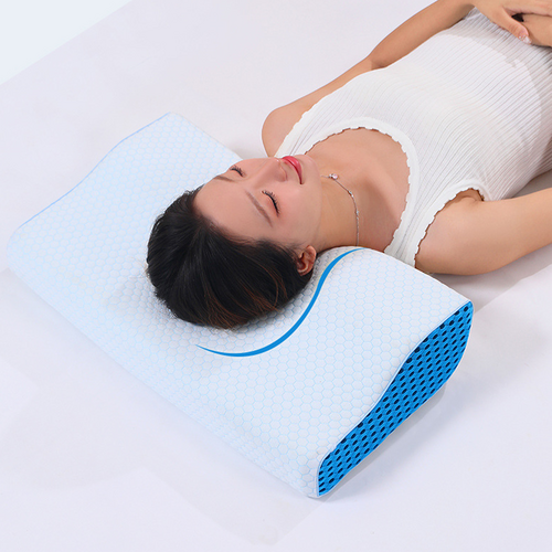 Woman resting on the compact contoured memory foam pillow in a back-sleeping position