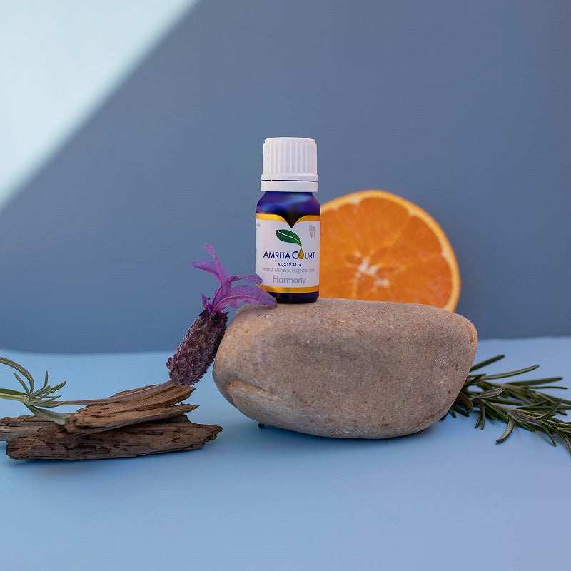 Amrita Court Harmony 10mL essential oils blend displayed with botanicals