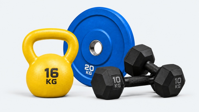 Blue weight plate, yellow kettlebell and black dumbbells for free weights